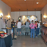a group of people at the Tolino tasting bar 
